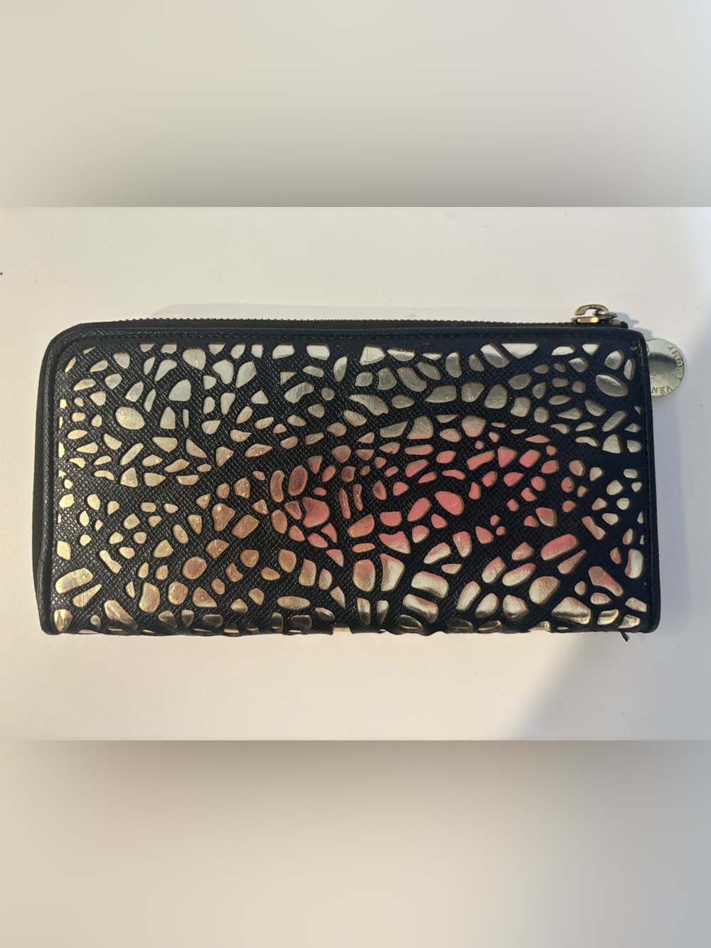 Ivanka Trump continental zip-around wallet featuring a signature laser-cut geome